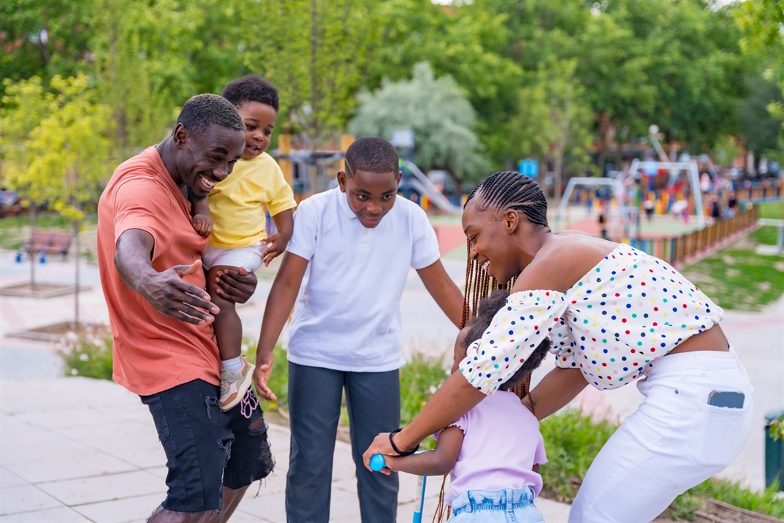 family at park, smiling and having fun