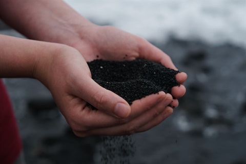 person holding soil