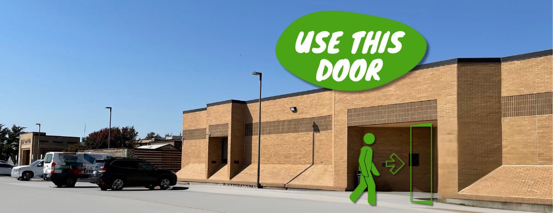 silhouette of a person using a side entrance at Grand Prairies Main Library 